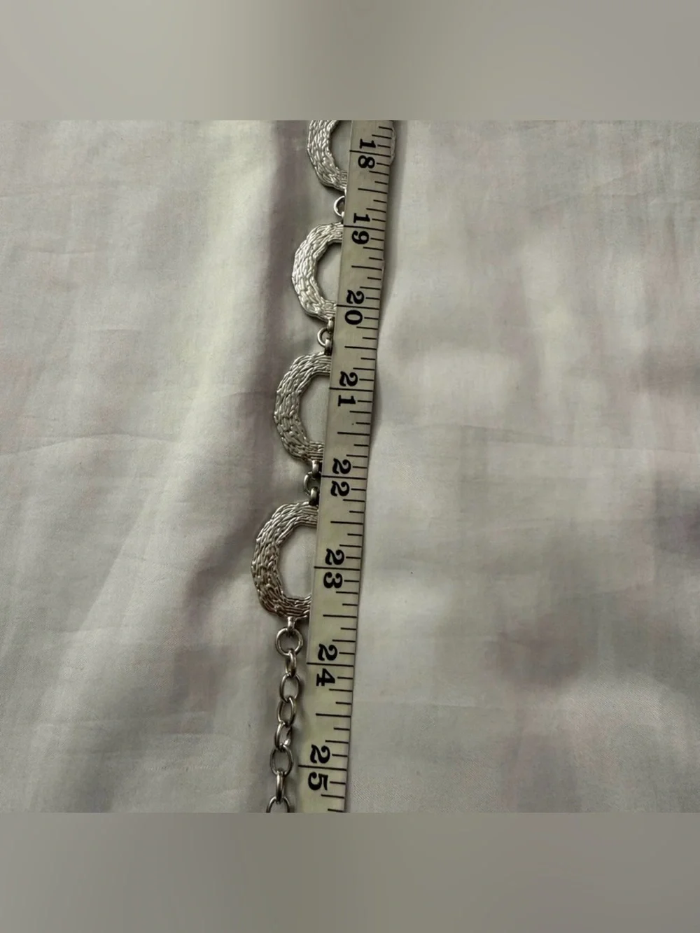 Silver tone metallic skinny chain belt
